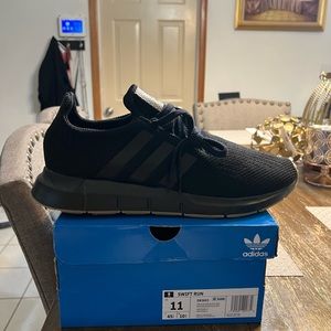 New pair of black Swift Run Adidas